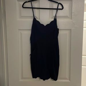 Navy blue romper with pockets. Brand new with tags on.